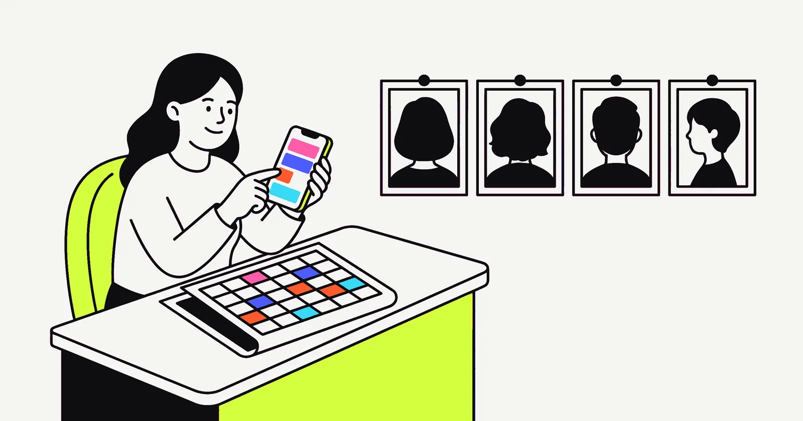 A woman at a desk holding a phone with coloured post blocks, a colour-coded weekly calendar on the desk and four framed portraits pinned on the wall